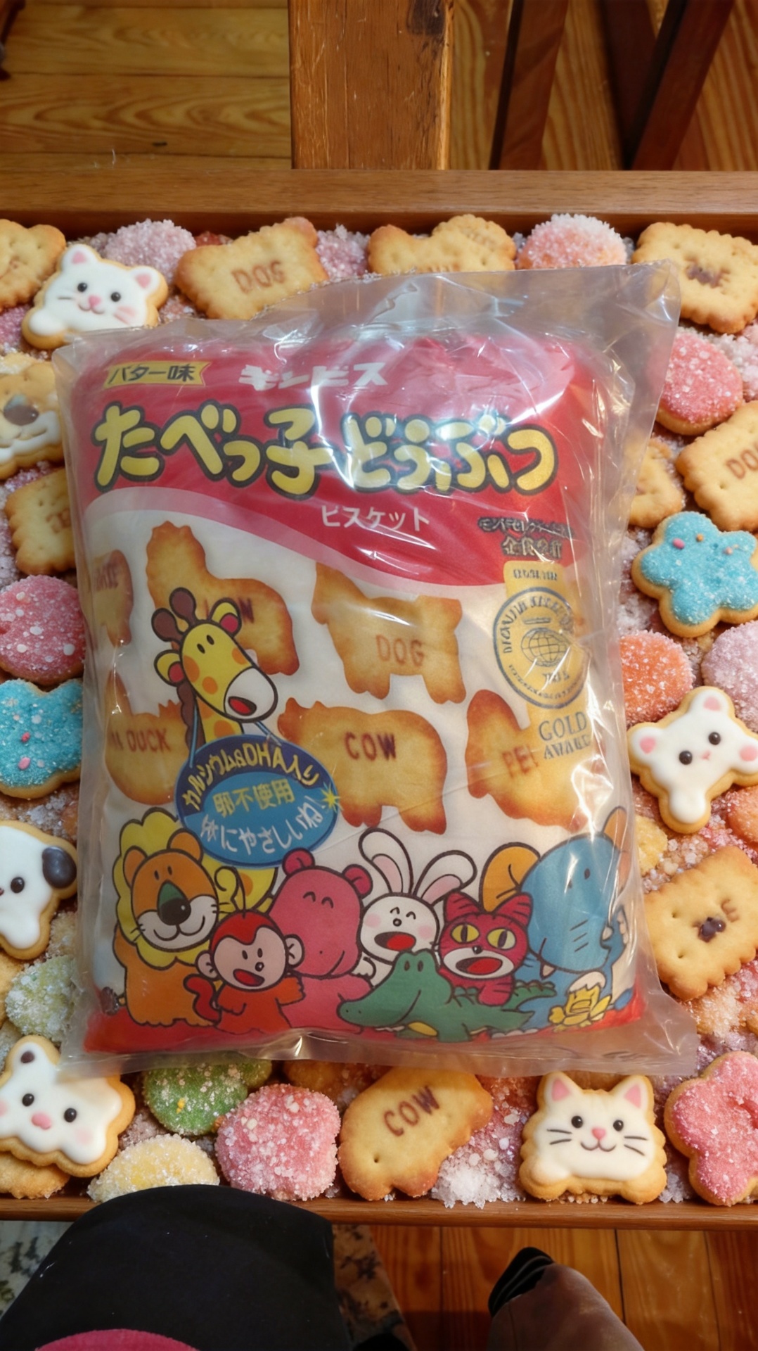 The sealed Tabekko Dobutsu cushion resting on a wooden cottage shelf among animal biscuit decor